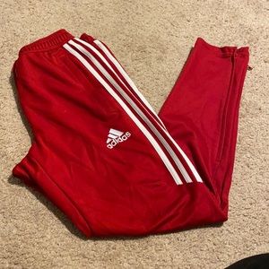Red adidas track pants